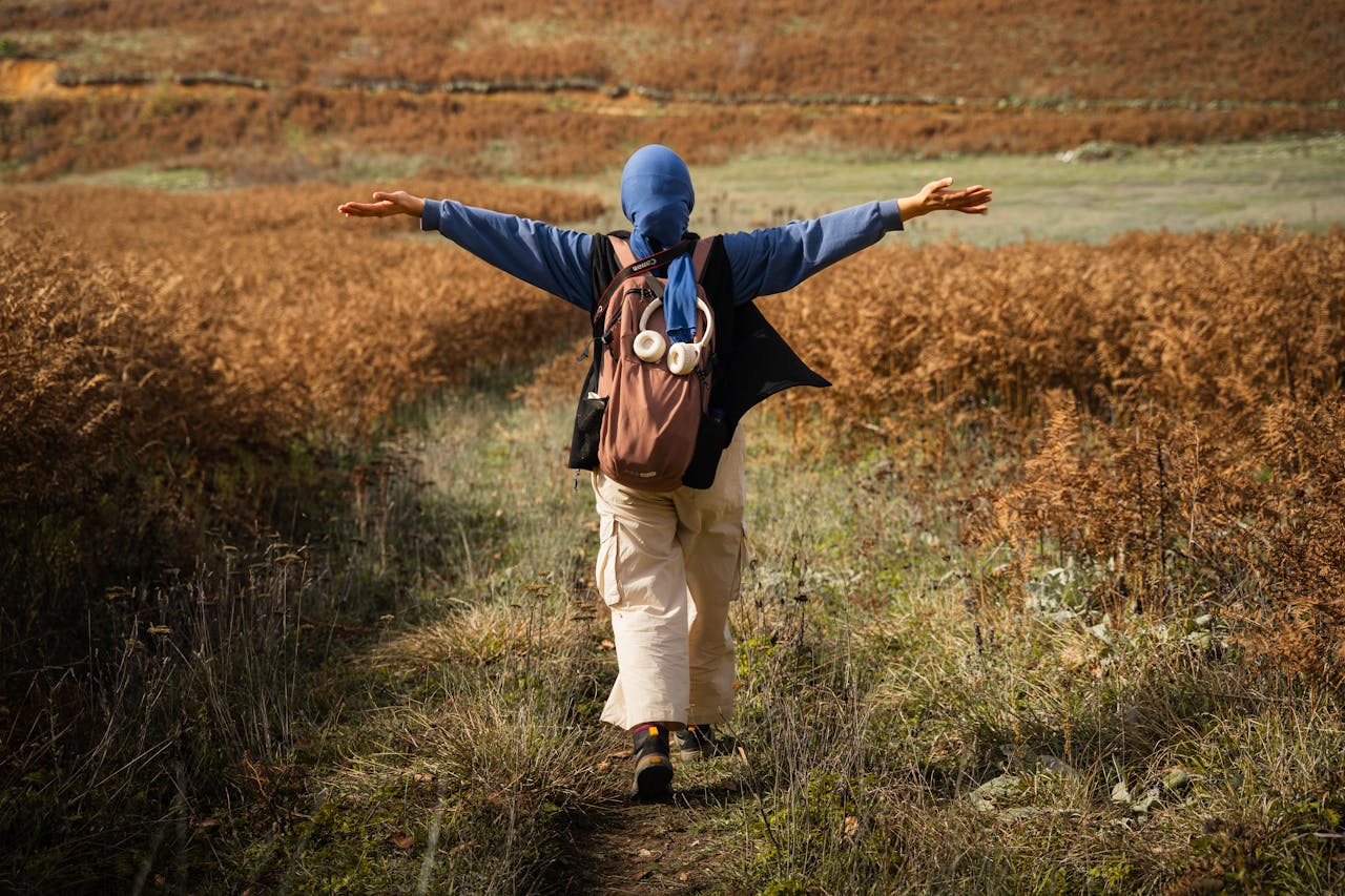 A traveler enjoys a hike through a scenic autumn landscape in Domaniç, Türkiye.